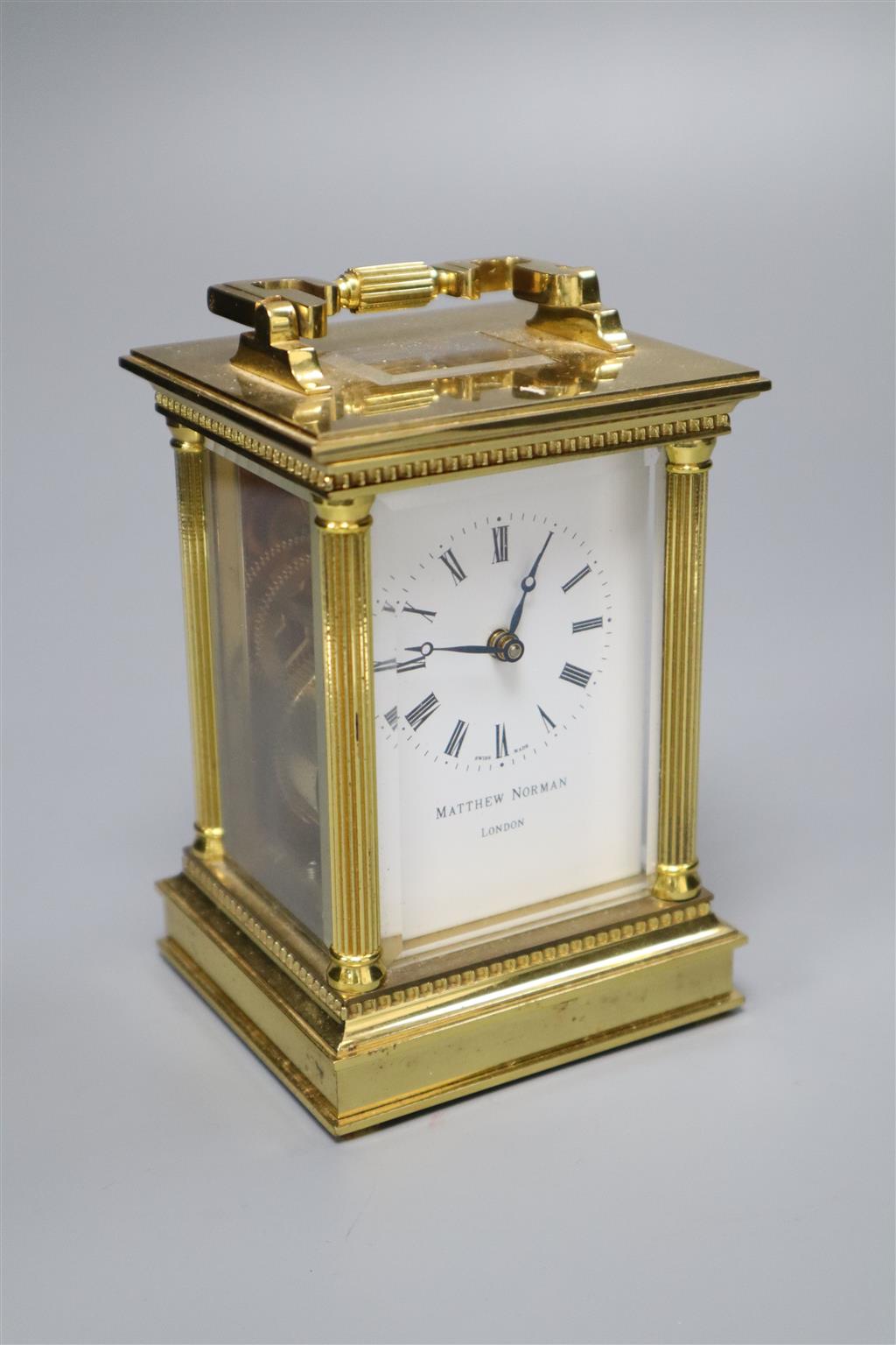 A Matthew Norman brass cased carriage timepiece, serial no.1754, height with handle down 13cm